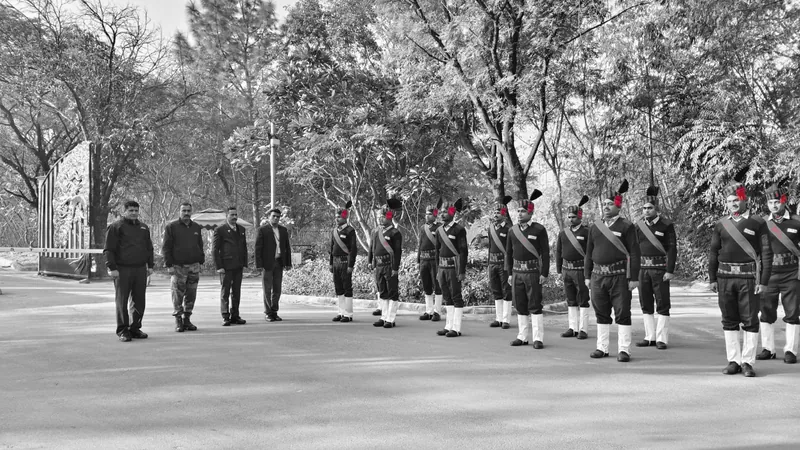 Officers in ceremonial dress drawn up on a site road, with supervisors and managers at the head of the parade
